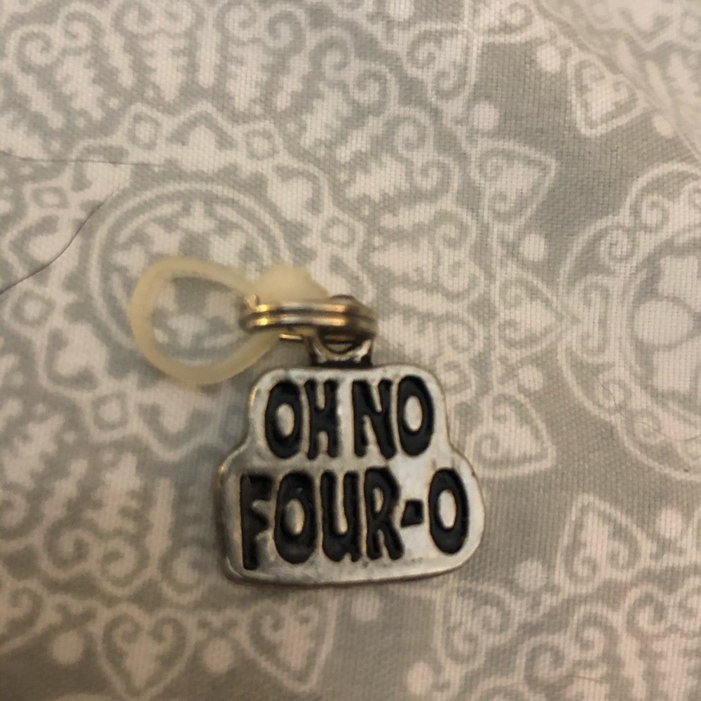 GANZ silver toned charm-four o